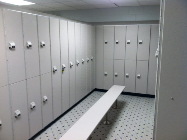 1 and 2-tier HDPE lockers in a locker room with a cement finish, by PSiSC.