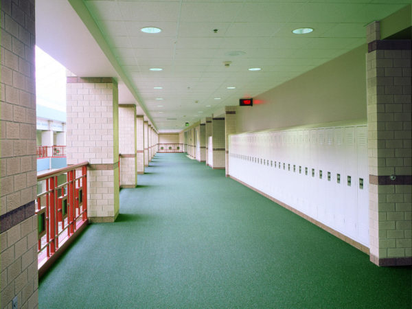 Standard Lockers in a hallway with a white finish, by Republic Storage Products.