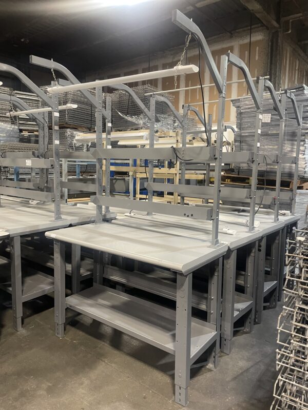 Multiple used 24x48 workbenches with back risers and light bars